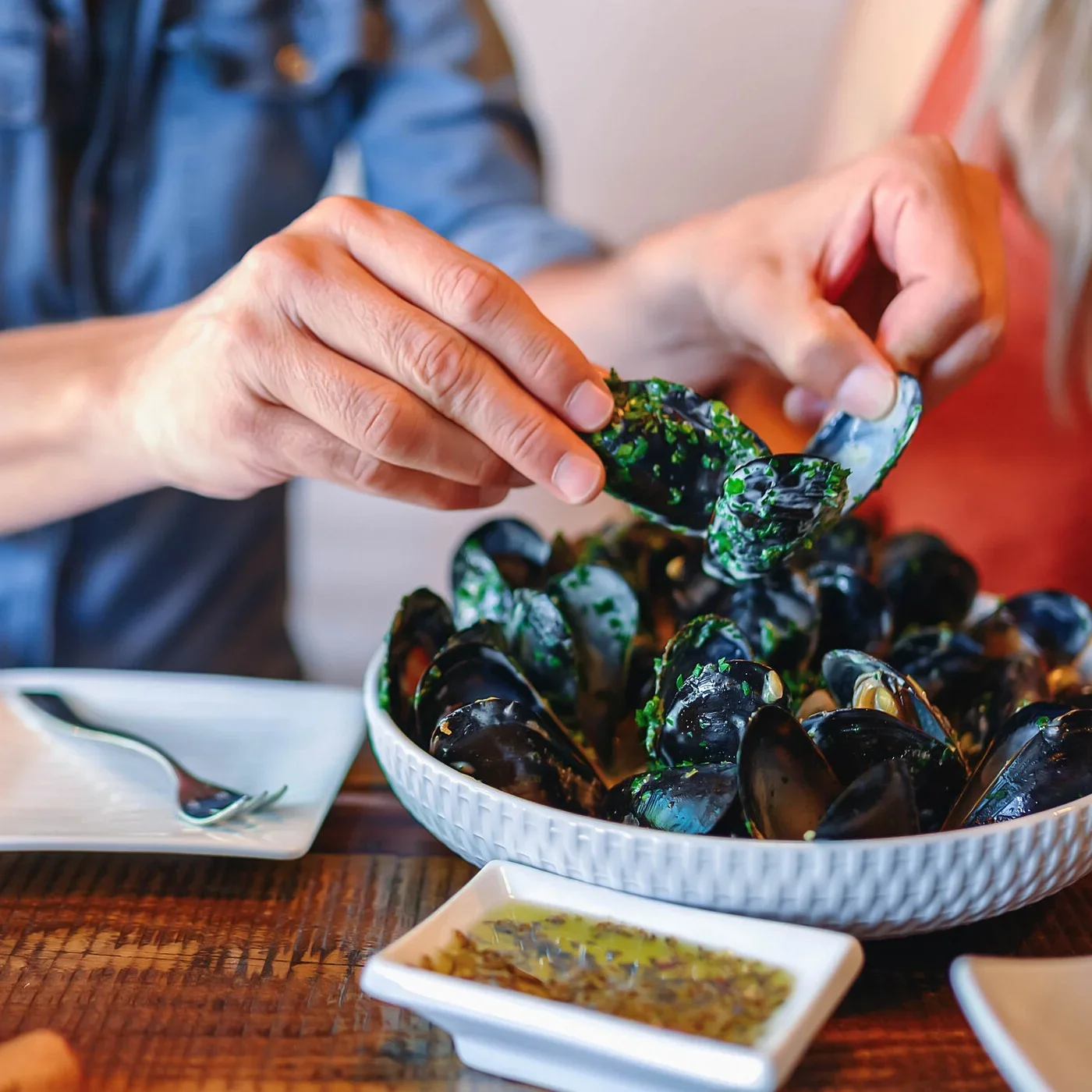 Guests sharing moules marinières at Bistro Mistral